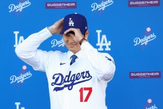 LOS ANGELES, CA - DECEMBER 14: The Los Angeles Dodgers introduce Shohei Ohtani as the newest member of the team during a press conference at Dodger Stadium in Los Angeles Thursday, Dec. 14, 2023. The Dodgers signed Ohtani to a 10-year $700 million contract on a blockbuster free agency signing. (Wally Skalij / Los Angeles Times)