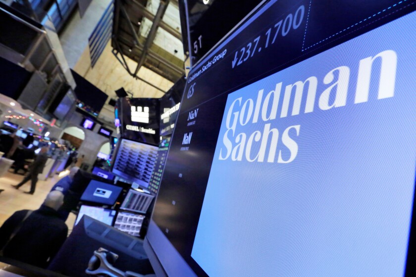 FILE - In this Dec. 13, 2016, file photo, the logo for Goldman Sachs appears above a trading post on the floor of the New York Stock Exchange. Goldman Sachs had the second-best quarterly profit in the firm's history in the quarter ended in June 2021, helped by a strong performance in its investment banking division that more than made up for a decline in trading revenues. (AP Photo/Richard Drew, File)