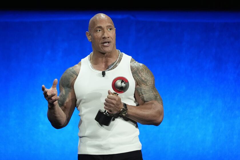 Dwayne Johnson accepts the CinemaCon "Spirit of the Industry" award during the Walt Disney Studios presentation at CinemaCon 2024, Thursday, April 11, 2024, at Caesars Palace in Las Vegas. (AP Photo/Chris Pizzello)