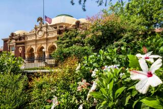 Los Angeles, CA - September 07: Top 40 locations to visit during the fall in California on Tuesday, Sept. 7, 2021 in Los Angeles, CA. - Exposition Park Rose Garden with the Los Angeles County Historical and Art Museum in the back. (Ricardo DeAratanha / Los Angeles Times)