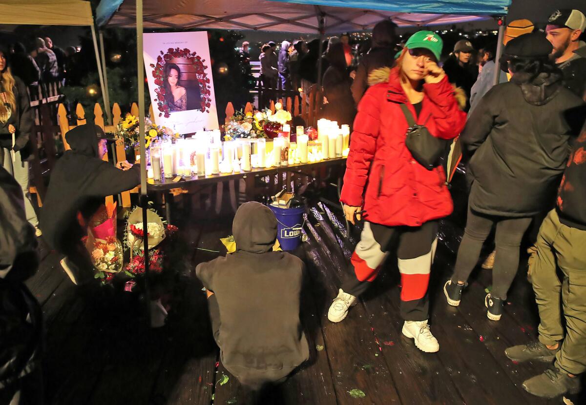 Mourners gather around a shrine and pay respects to Tatum Goodwin on Wednesday.