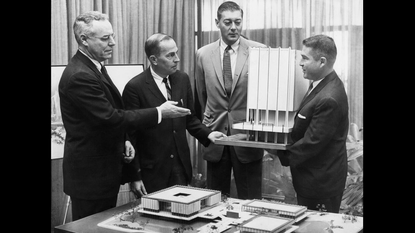 Executives examine models of the $10-million Los Angeles Art Museum project, completed in 1965. Edward W. Carter, museum president, left; Dr. Franklin D. Murphy, UCLA chancellor; Sidney F. Brody, vice president, and Dr. Richard F. Brown, director.