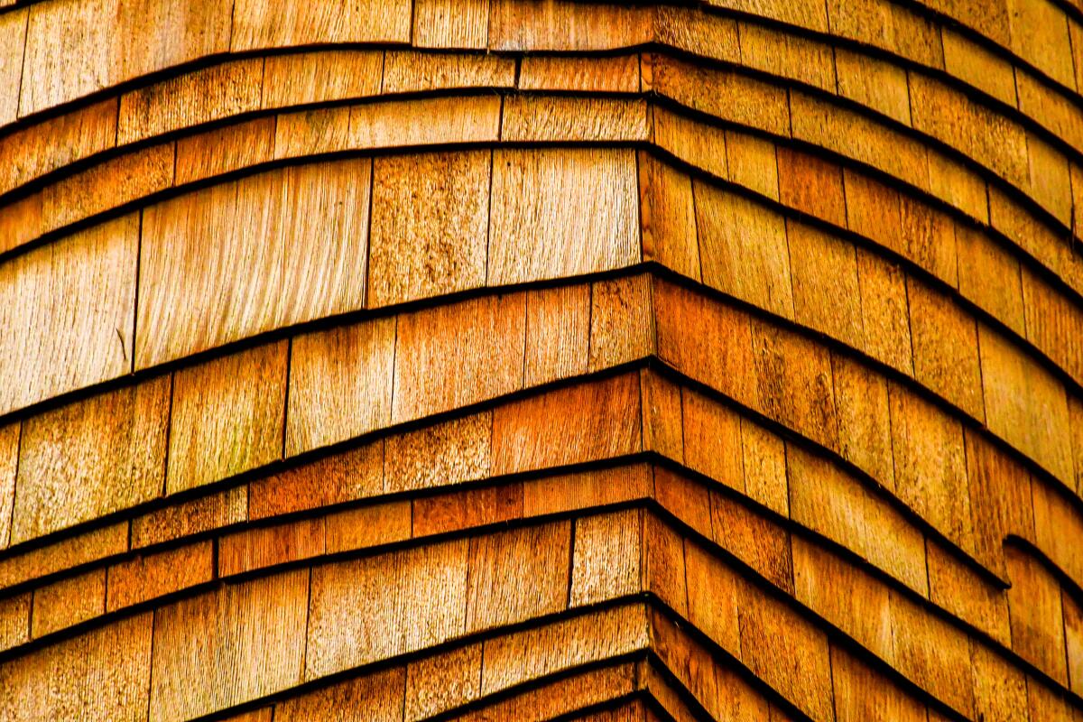 Closeup of a wood shingles on a treehouse.