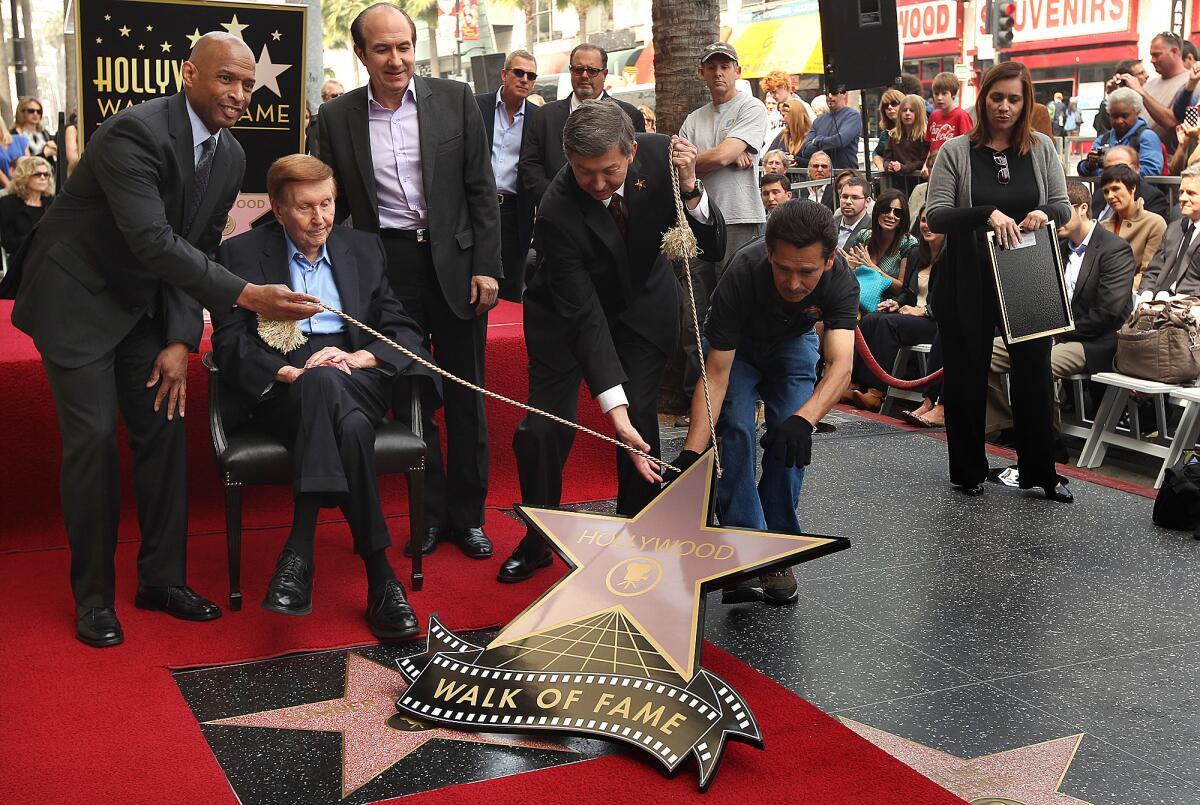 Sumner Redstone receives a star on the Hollywood Walk of Fame in 2012.