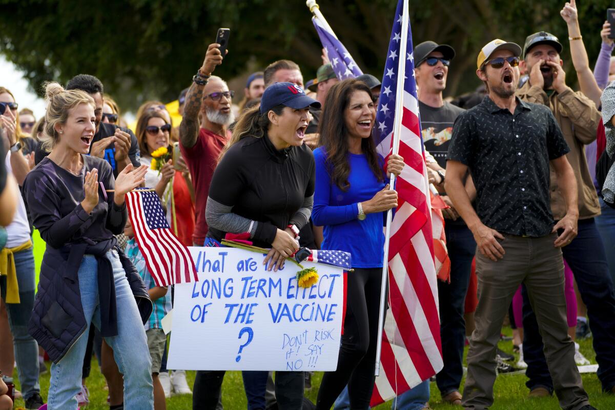 A crowd protests a vaccine mandate proposal at the San Diego Unified School District headquarters Sept. 28.