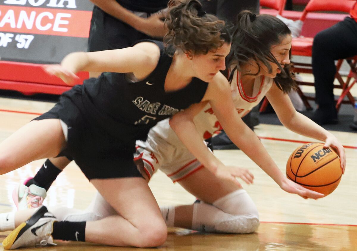 Sage Hill's Emily Eadie (1) and Mater Dei's Addie Deal (3) dive for a loose ball in the Matt Denning Nike Hoops Classic.