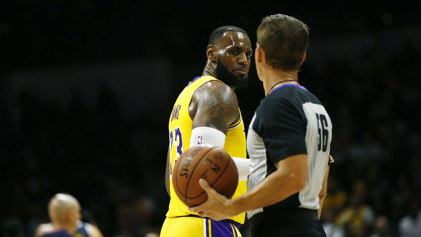 Los Angeles Lakers LeBron James looks at a referee after a foul during a preseason game against the Denver Nuggets in San Diego on Sunday, September 30, 2018. (Photo by K.C. Alfred/San Diego Union-Tribune)