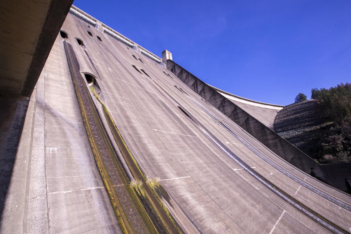 Shasta Dam stands 602 feet tall. 