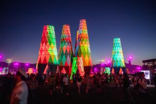 INDIO, CALIFORNIA - APRIL 21: Festival goers gather and walk around Sarbale ke during the 2019 Coachella Valley Music And Arts Festival on April 21, 2019 in Indio, California. (Photo by Timothy Norris/Getty Images for Coachella)
