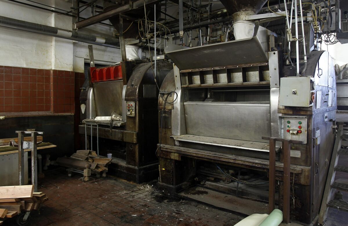 Machinery from bakery days still sits in Bread & Salt and the new owners plan to leave it in place as a reminder of the building's past. — K.C. Alfred