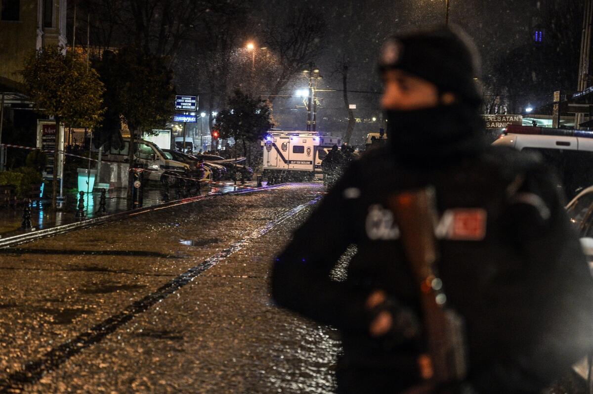 A Turkish police officer stands guard near a police station where a woman detonated a suicide bomb Jan. 6 in Istanbul's main tourist district of Sultanahmet.