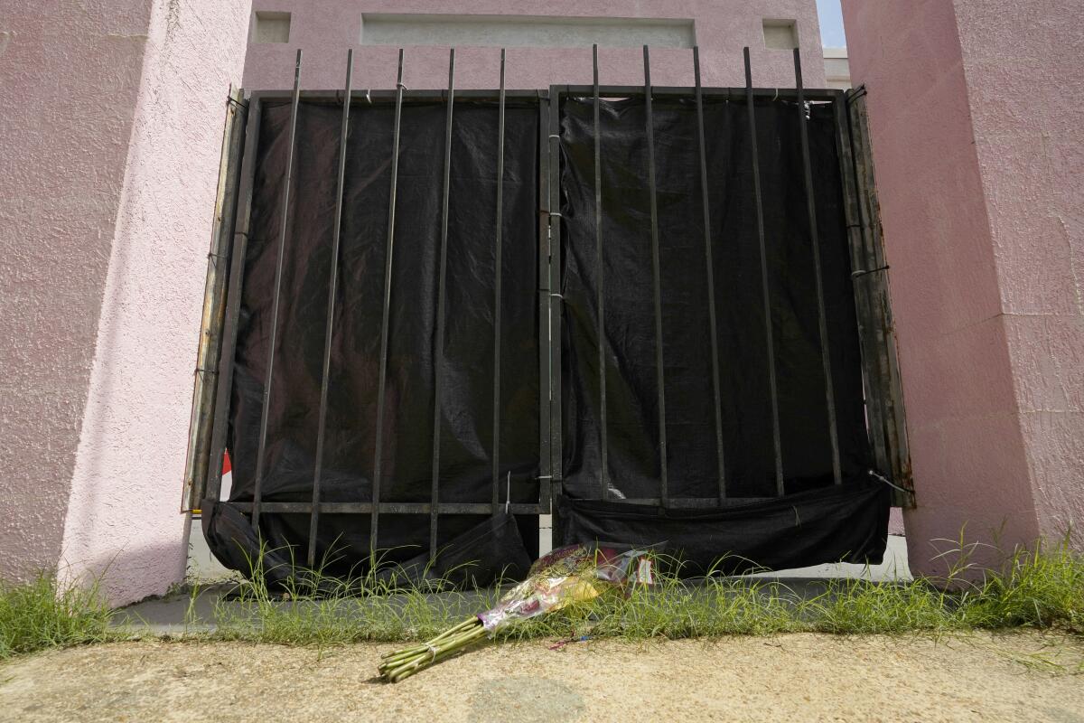 A bouquet of roses left at the gates of the women's health clinic.