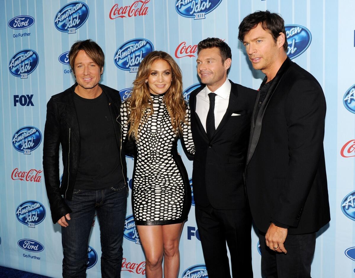 From left: Musician Keith Urban, singer Jennifer Lopez, host Ryan Seacrest and singer Harry Connick Jr. arrive at the premiere of Fox's "American Idol XIII."