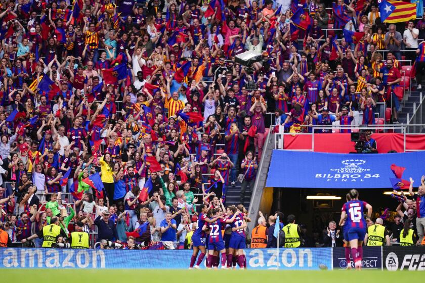 Barcelona's fans celebrate after Alexia Putellas scoring her side's 2nd goal during the women's Champions League final soccer match between FC Barcelona and Olympique Lyonnais at the San Mames stadium in Bilbao, Spain, Saturday, May 25, 2024. (AP Photo/Jose Breton)