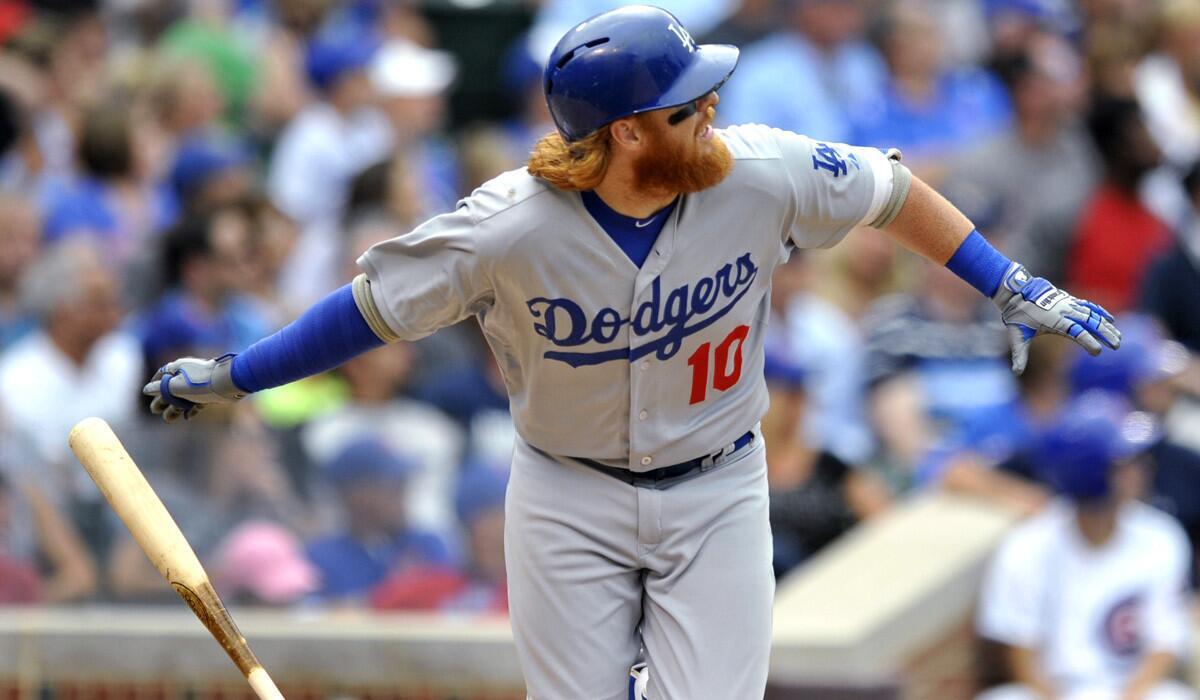 Los Angeles Dodgers' Justin Turner hits a triple during the seventh inning against the Chicago Cubs on June 25, 2015.