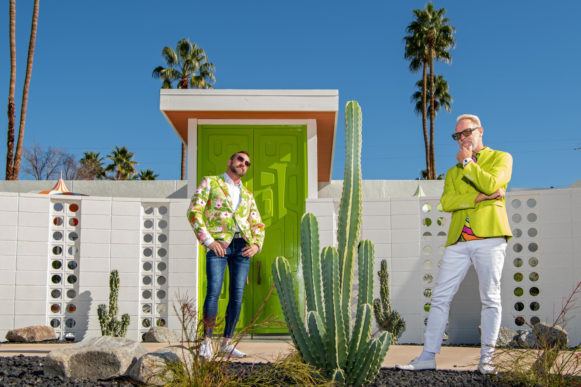 Brandon McBurney and Josh Agle outside a Midcentury Modern home with a lime green door