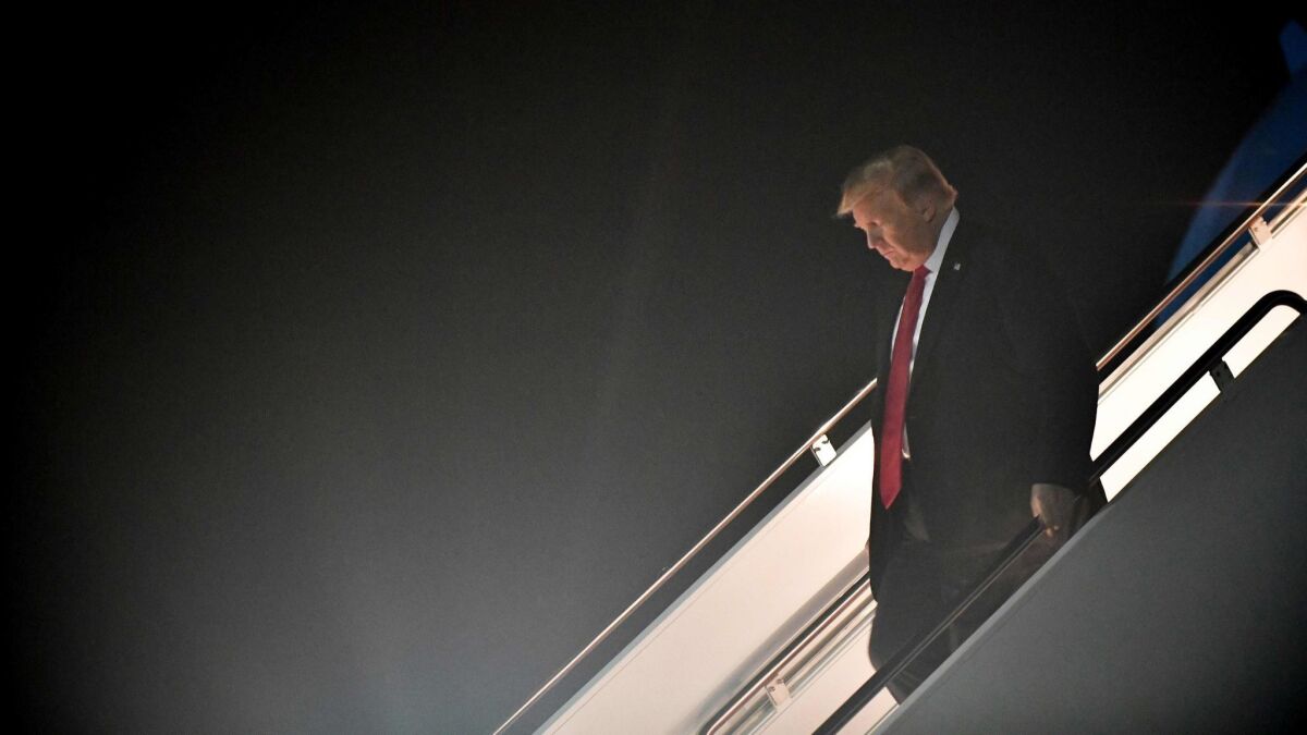 President Trump steps off Air Force One at Andrews Air Force Base in Maryland upon returning from a rally in Council Bluff, Iowa, on Oct. 9.
