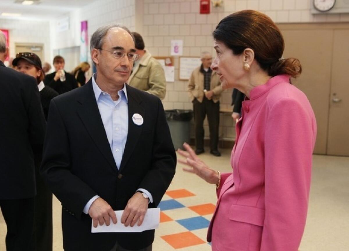 Sen. Olympia Snowe (R-Maine) speaks with state Treasurer Bruce Poliquin during the Kennebec County Super Caucus in Augusta, Maine, this month.
