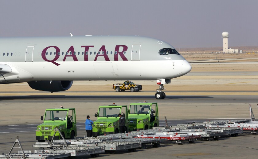FILE - The first Qatar Airways plane in three years lands at King Khalid Airport in Riyadh, Saudi Arabia, Monday, Jan. 11, 2021. Airbus says it has terminated a multibillion dollar order by Qatar Airways for 50 of its single-aisle A321neo jet. The termination of the contract comes as the planemaker and its major Gulf customer, Qatar Airways, are embroiled in a legal dispute in London over the grounding of the larger Airbus A350 aircraft by the Gulf-based airline. (AP Photo/Amr Nabil, File)
