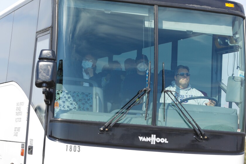 The first bus with coronavirus evacuees leaves Miramar.