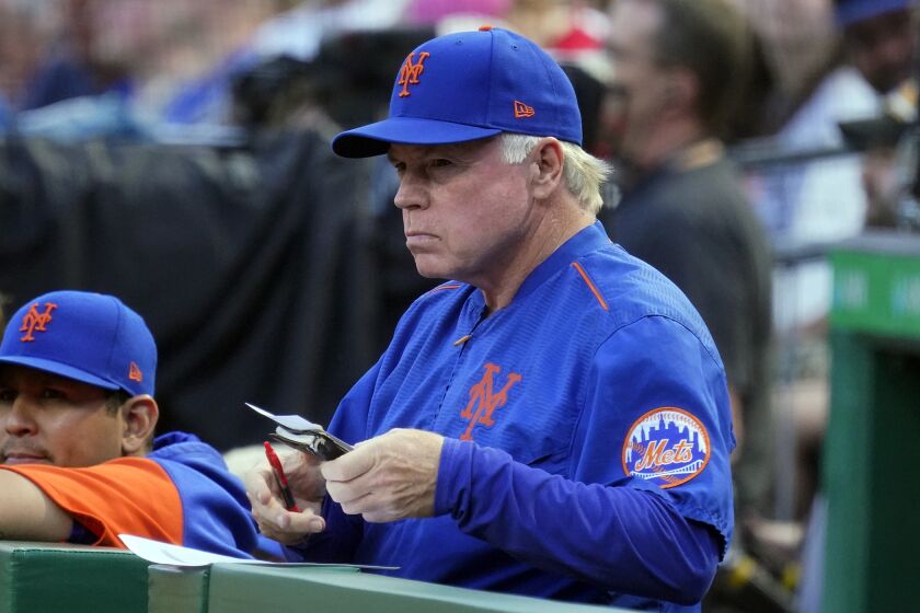 New York Mets manager Buck Showalter stands in the dugout during the second inning of the team's baseball game against the Pittsburgh Pirates in Pittsburgh, Tuesday, Sept. 6, 2022. (AP Photo/Gene J. Puskar)