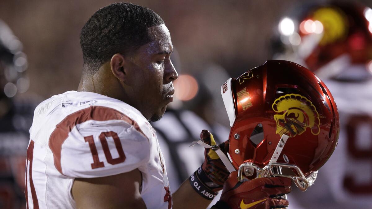 USC linebacker Hayes Pullard puts on his helmet during the Trojans' loss to Utah on Oct. 25.