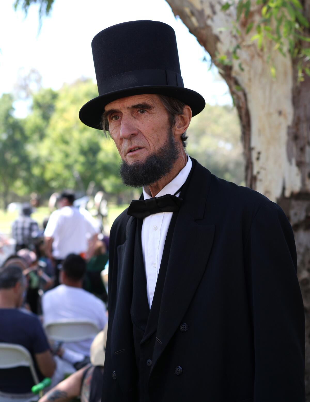 An actor portraying Abraham Lincoln cheers on the Union army at the Civil War Days in 2019.