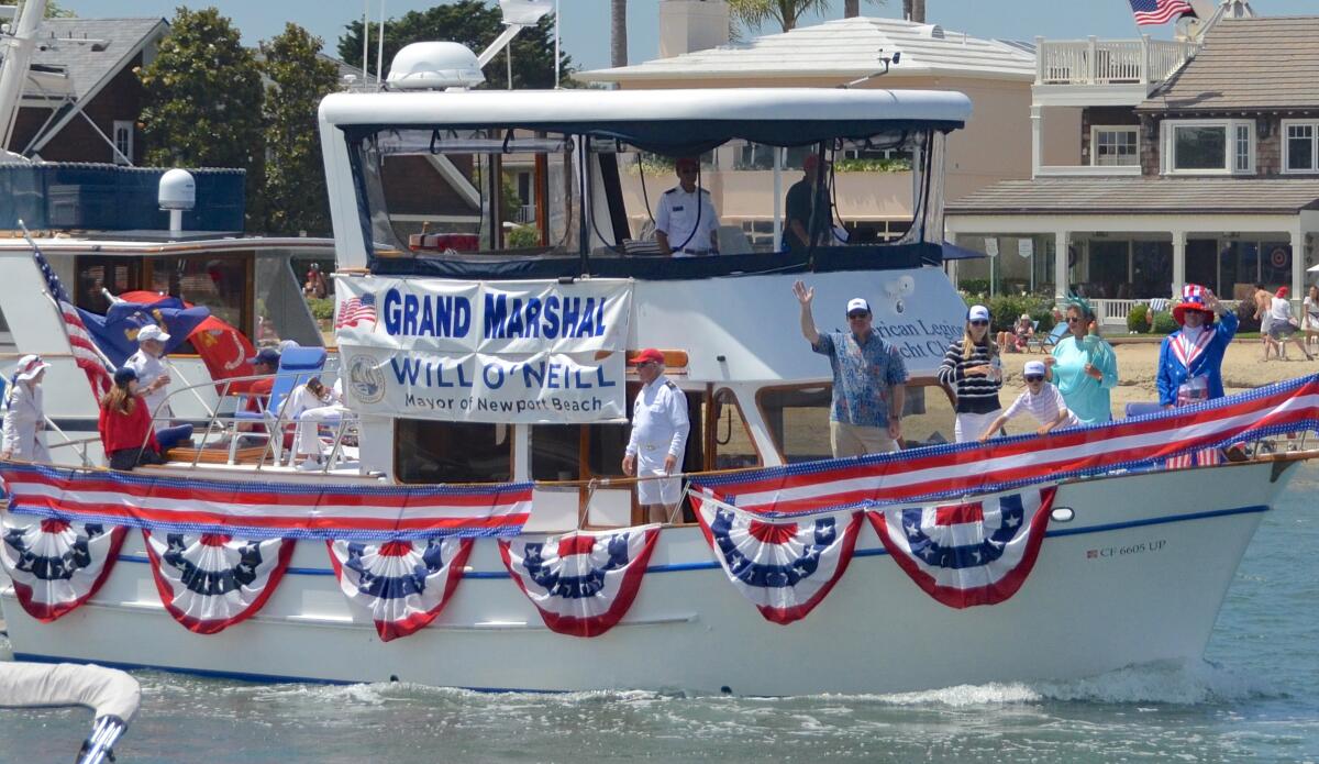 Mayor Will O'Neill aboard the American Legion yacht charter boat, Valor, during the Old Glory Fourthof July boat parade.
