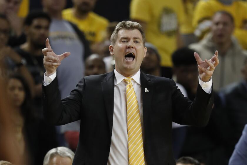 Appalachian State head coach Dustin Kerns yells from the sidelines during the second half of an NCAA college basketball game against Michigan, Tuesday, Nov. 5, 2019, in Ann Arbor, Mich. (AP Photo/Carlos Osorio)