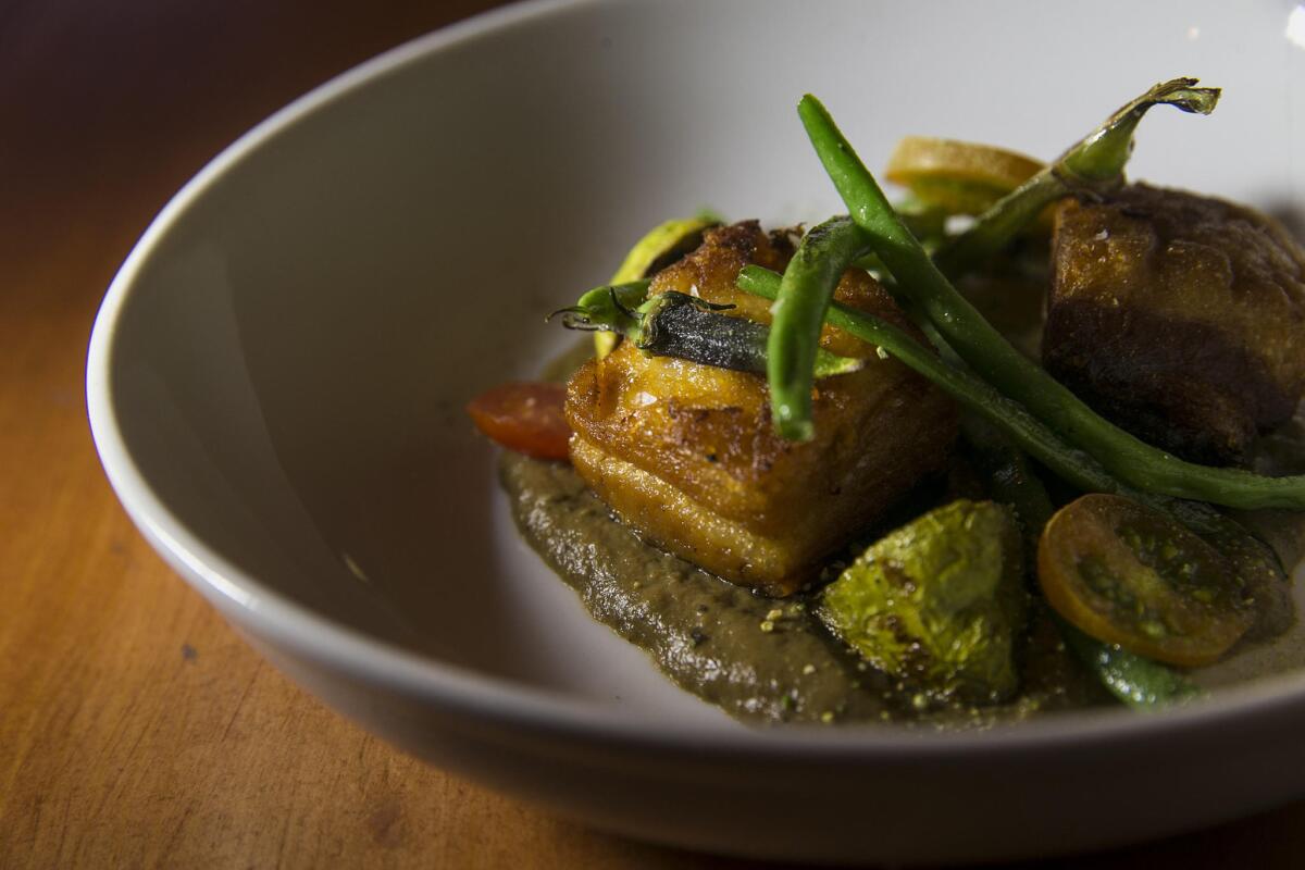 Lasa dish: twice-cooked pork belly with smoky eggplant, summer vegetables and ampalaya powder.