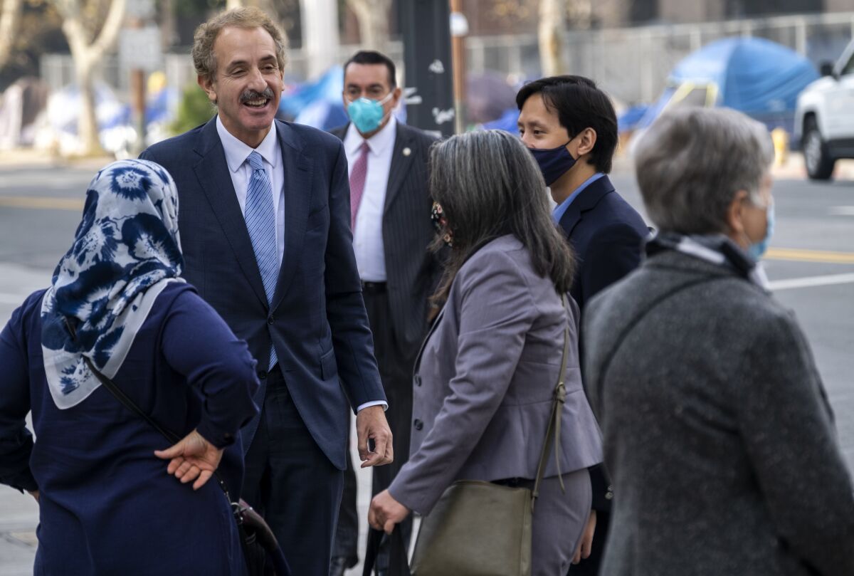 City Attorney and mayoral candidate Mike Feuer in front of City Hall at on Monday.