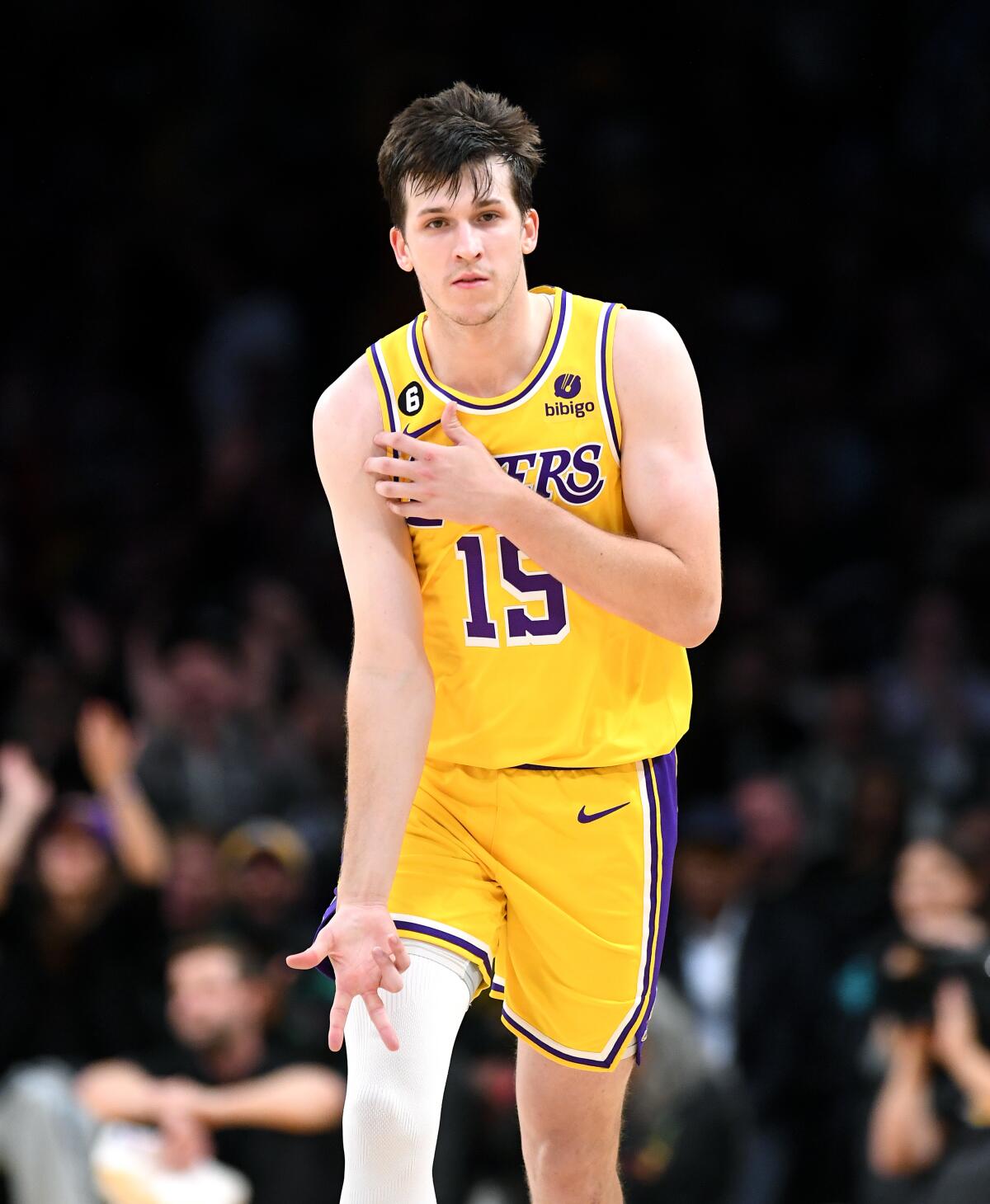 Lakers guard Austin Reaves celebrates his three-pointer against the Grizzlies by pointing to the ice in his veins.