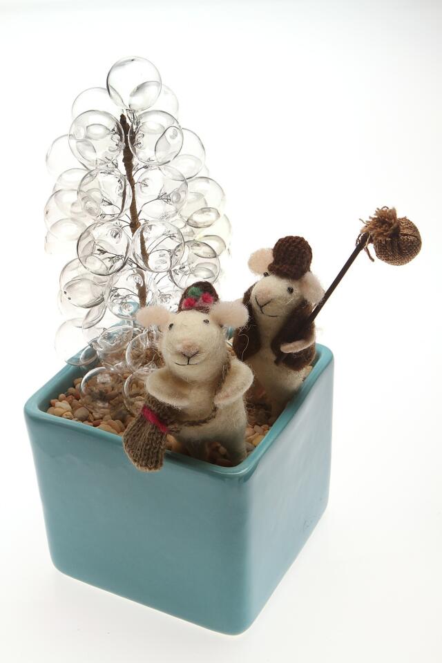 Even if cute isn't your thing, it's hard to resist mice that add a little Bohemian chic to the Christmas tree. We gave this pair an ethereal tree of their own -- handblown glass grapes, actually, that we stood up in planter of pebbles. Mice $12 a piece, glass tree $38, Colcha, 1416 Abbot Kinney Blvd., Venice, (310) 392-3600