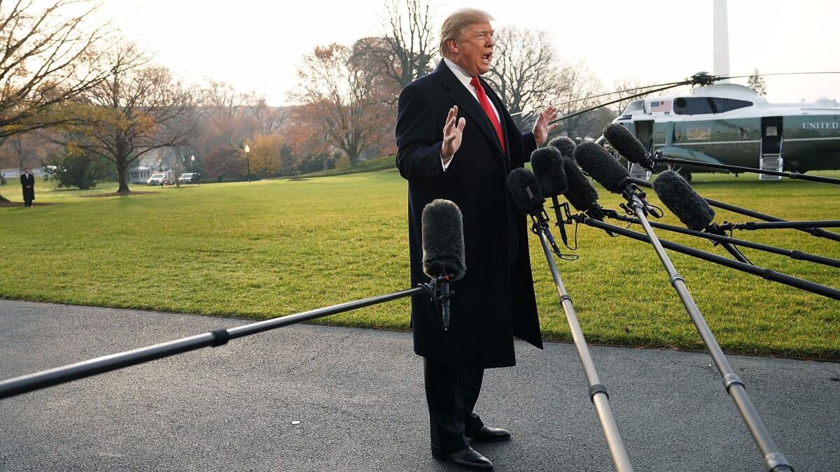President Trump speaks to members of the media outside the White House on Dec. 4 about former national security advisor Michael Flynn.
