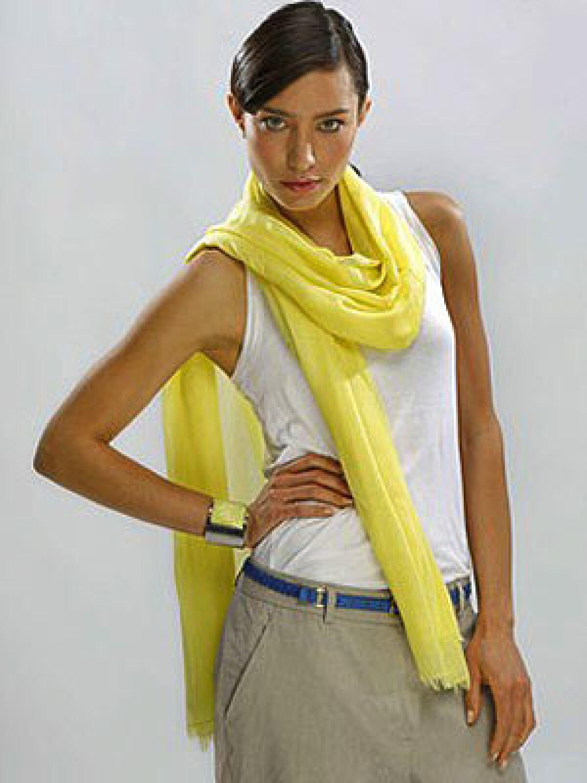 BRIGHT AND SHINY: Theory pants, $235 at www.neimanmarcus.com; MIH tank top, $63, Club Monaco scarf, $99, and cuff, $59, www.clubmonaco.com.