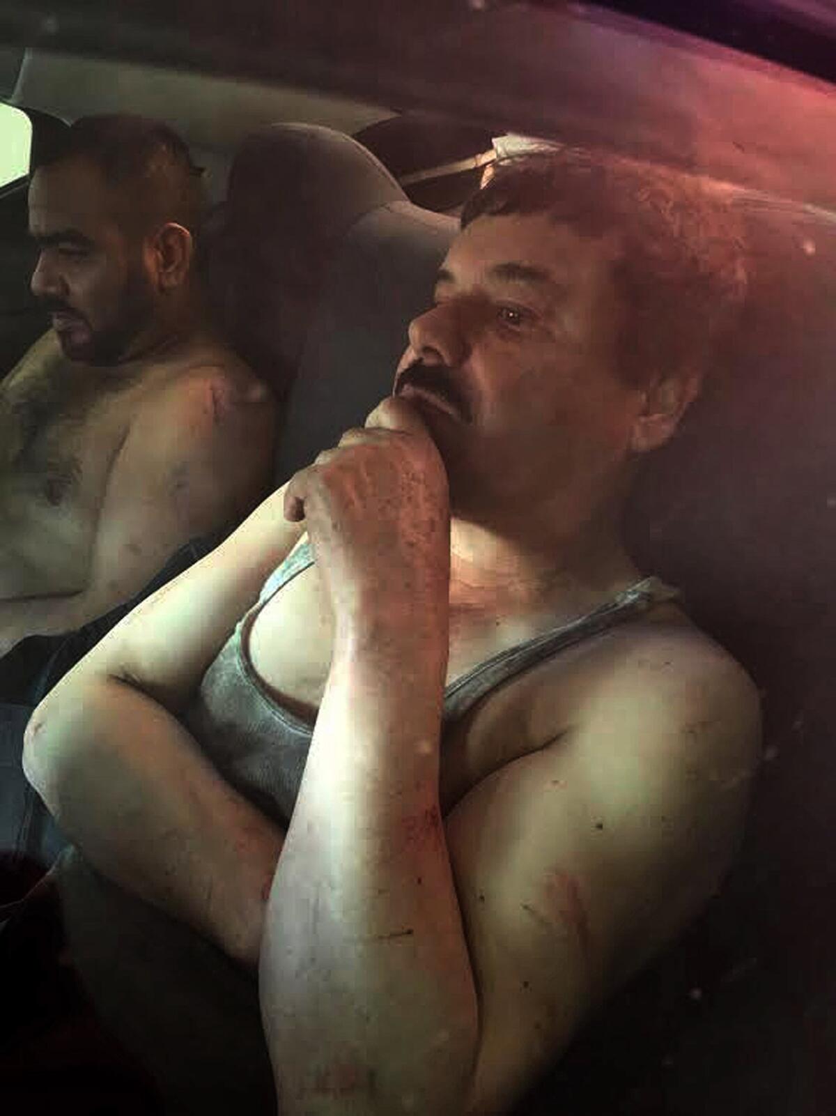 The Mexican website Plaza de Armas published this photograph of Joaquin "El Chapo" Guzman, right, after his capture Jan. 8, 2016.