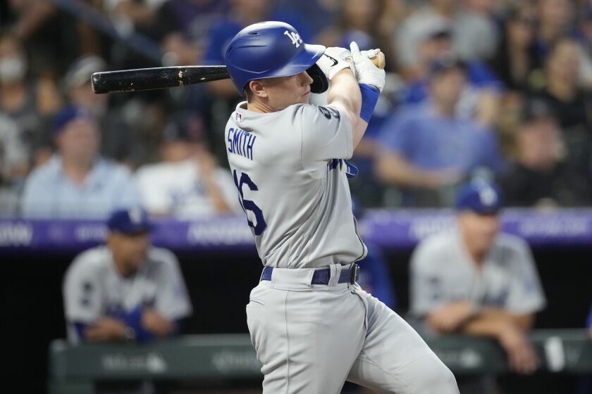 The Dodgers' Will Smith connects for a two-run single in the fifth inning against the Colorado Rockies on July 17, 2021.