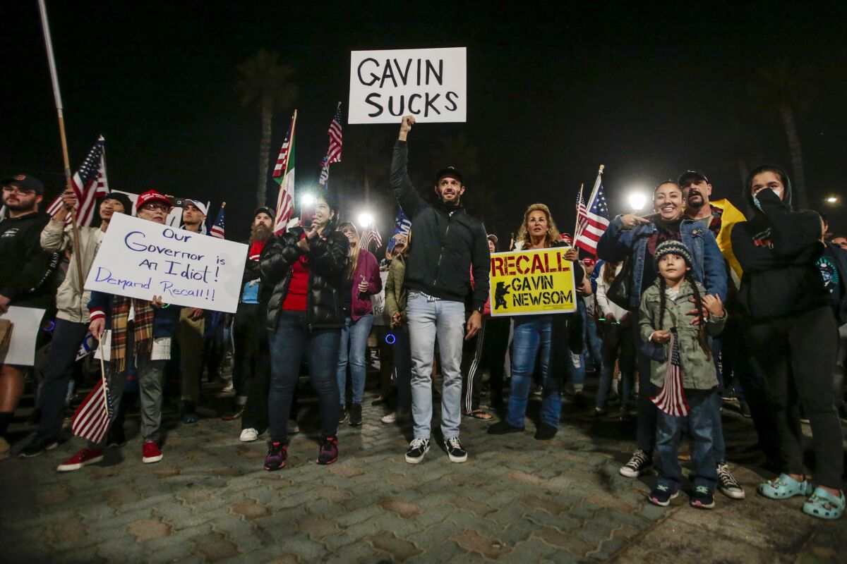 Protesters demonstrate on Pacific Coast Highway in Huntington Beach.