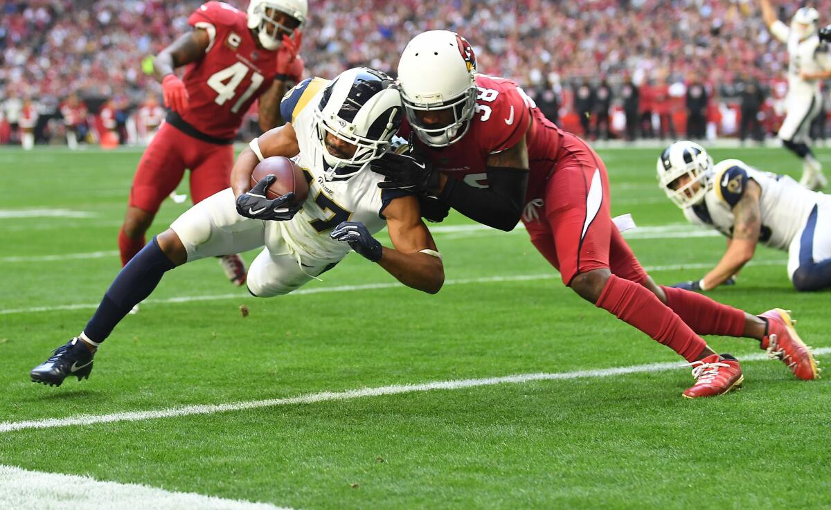 Rams wide receiver Robert Woods beats Cardinals conrerback David Amerson to the end zone for a touchdown in the first quarter at State Farm Stadium on Sunday.