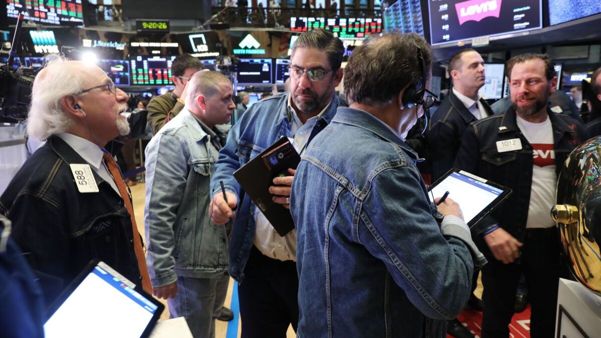 Levi Strauss' shares began trading on the New York Stock Exchange on Thursday, and the exchange loosened its dress code for the day so traders could wear denim.