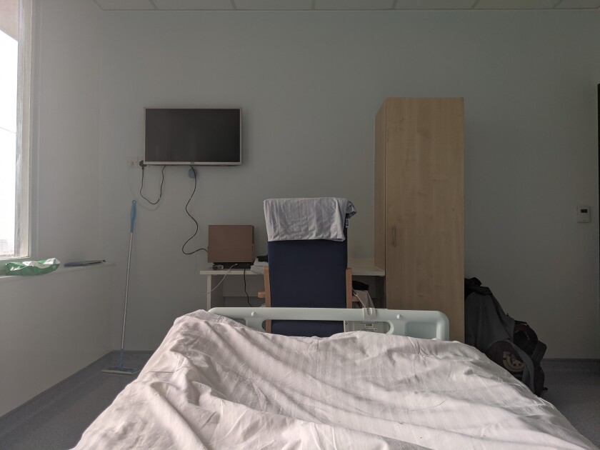 This hospital room was Jacob Hopkins' home for 17 days while he weathered a case of COVID-19 for the sake of science.