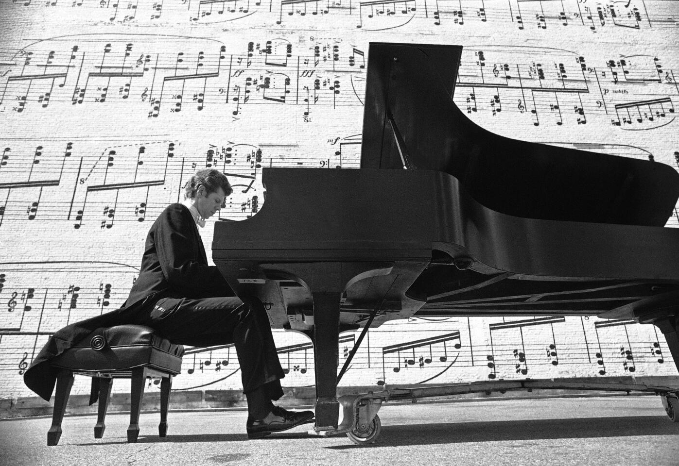 Van Cliburn plays in Minneapolis in 1977. He kept up a frenetic schedule of more than 100 concerts a year for two decades, until retiring from the performance circuit in 1978. In the mid-1990s he embarked on a long-anticipated comeback tour that drew poor reviews.