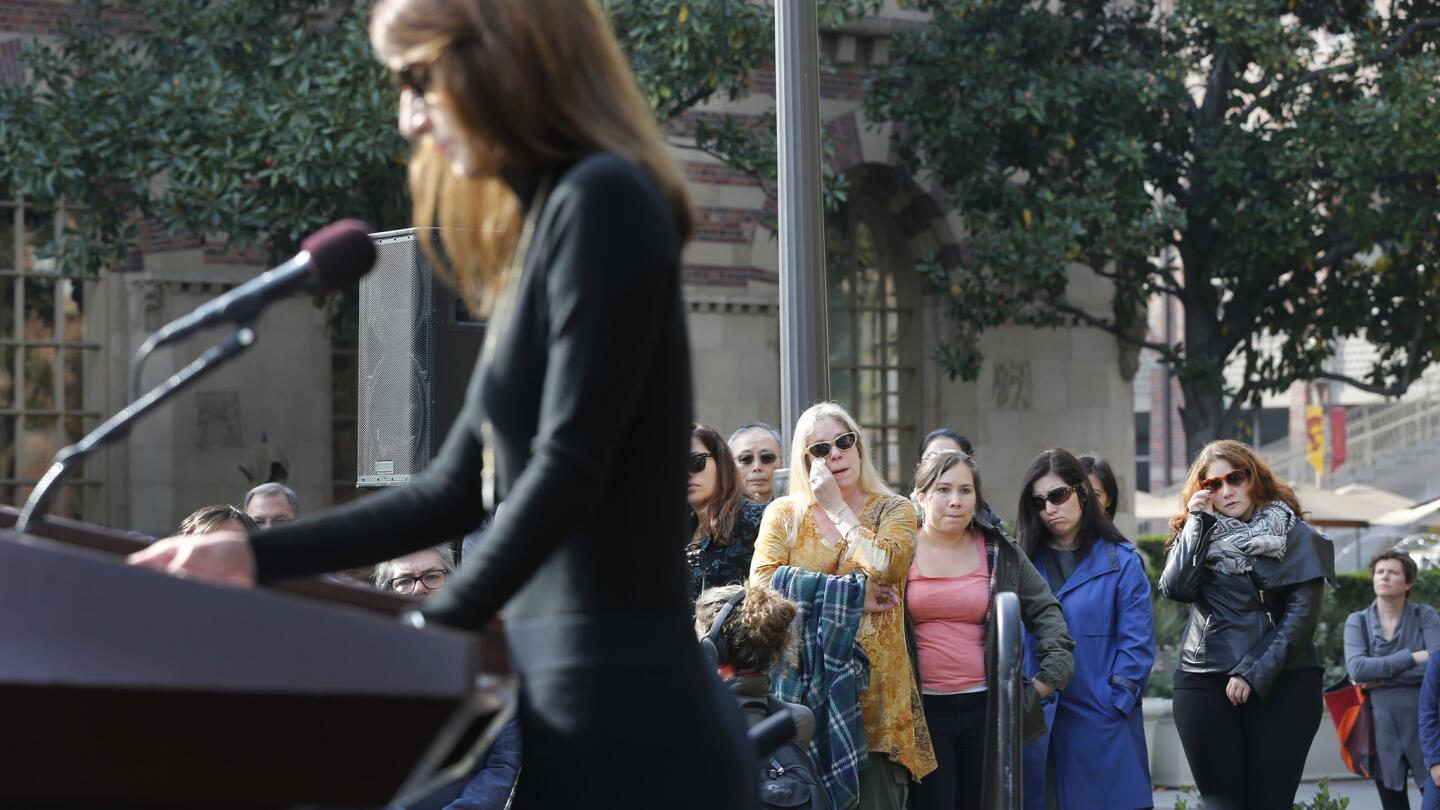 Mourners listen to USC graduate student Helga Mayzar speak.