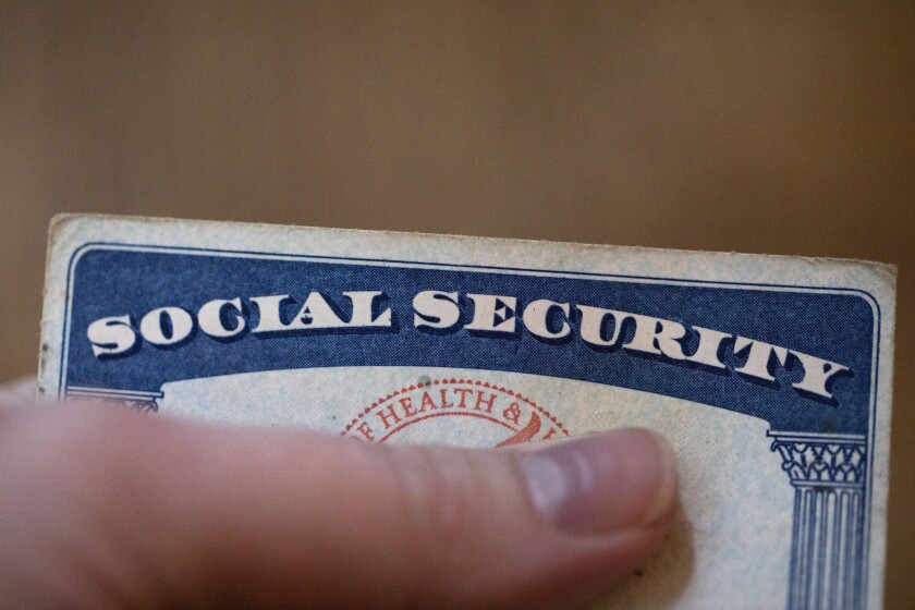 This Tuesday, Oct. 12, 2021, photo shows a Social Security card in Tigard, Ore. Social Security checks to increase by 5.9%, as inflation fuels largest COLA for retirees in nearly 40 years (AP Photo/Jenny Kane)