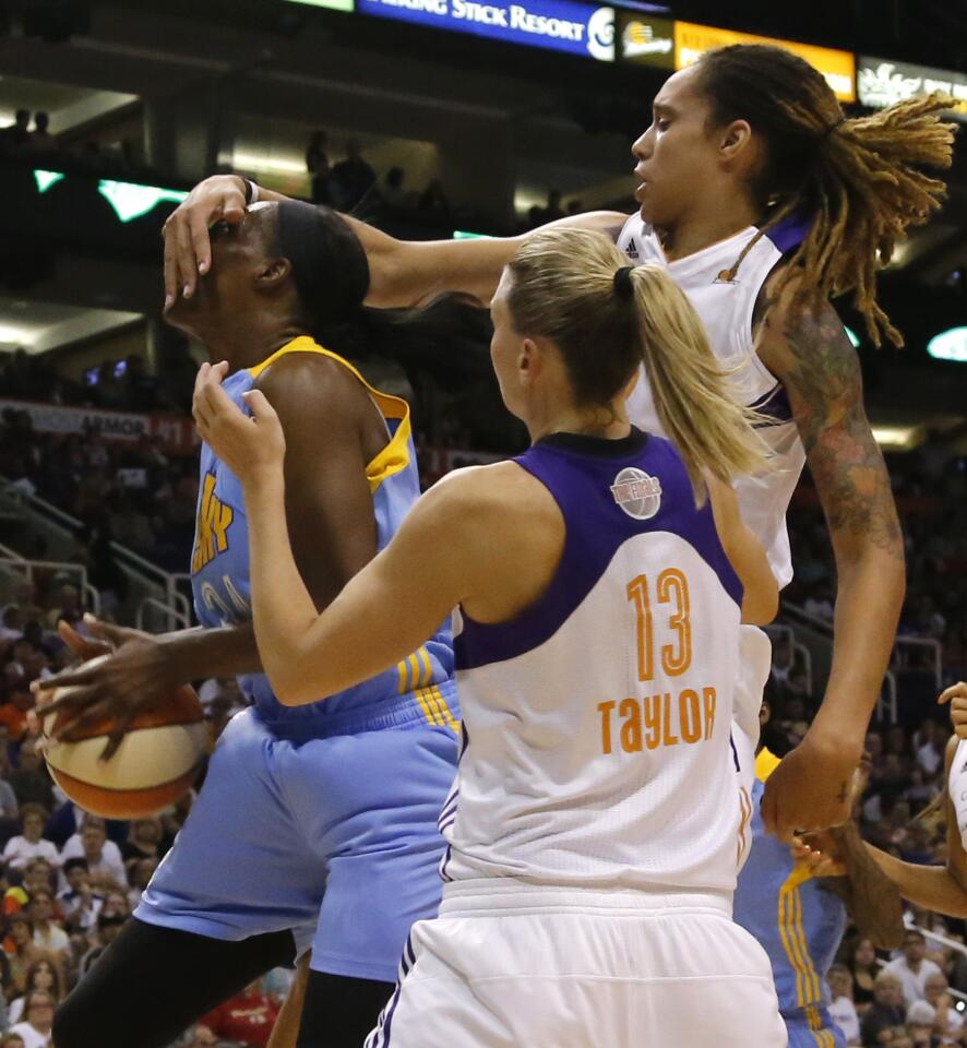 Phoenix Mercury center Brittney Griner fouls Sky center Sylvia Fowles (left) in the first quarter in Game 1 of the WNBA Finals.