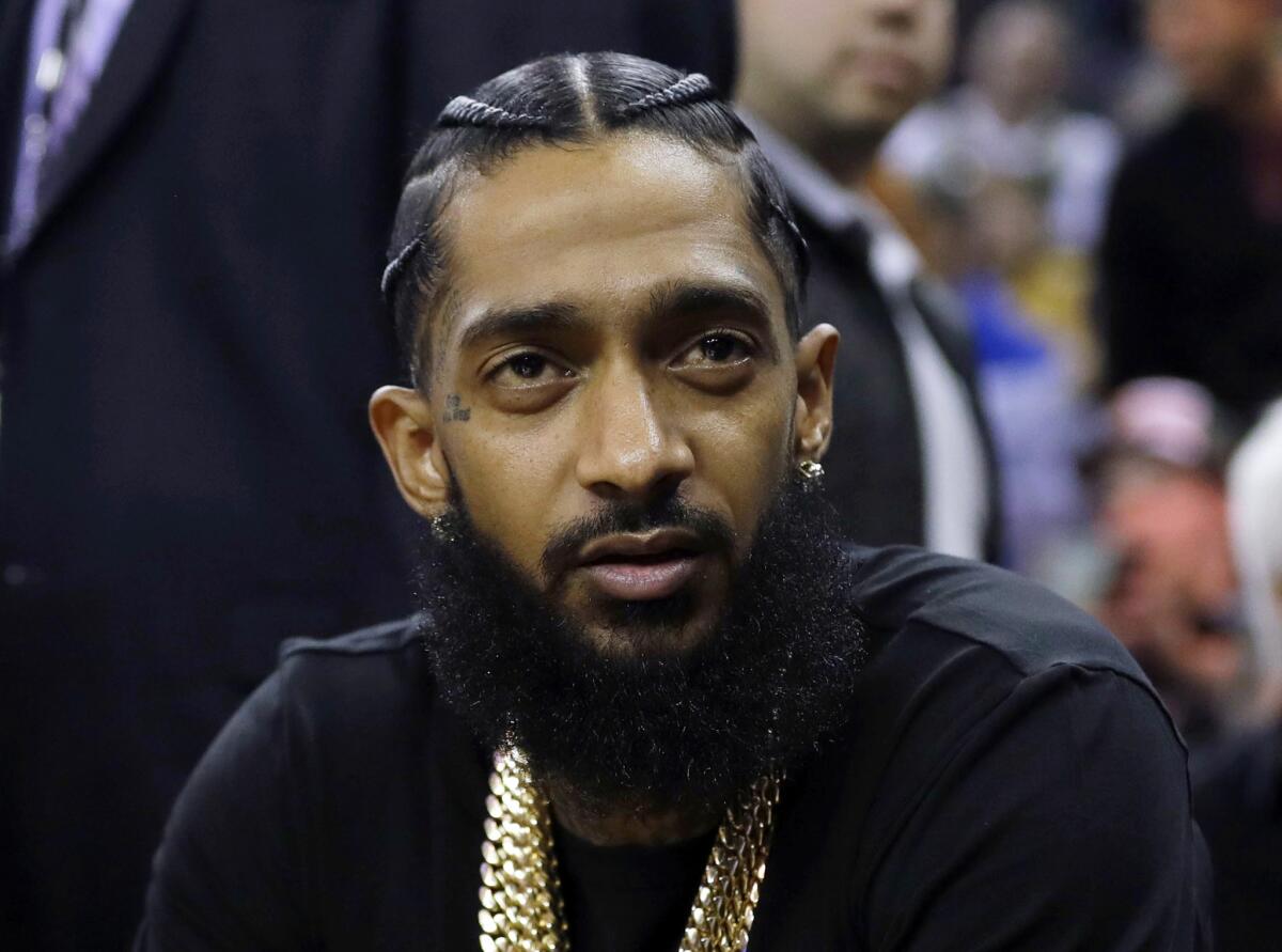 Rapper Nipsey Hussle at an NBA basketball game in Oakland in March 2018. Hussle was shot and killed March 31 outside of his clothing store in Los Angeles.