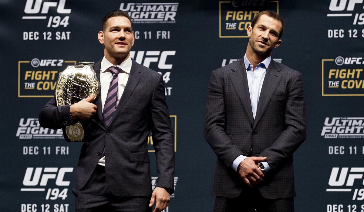 UFC middleweight champion Chris Weidman, left, with opponent Luke Rockhold at a news conference at Las Vegas' MGM Grand Garden Arena.