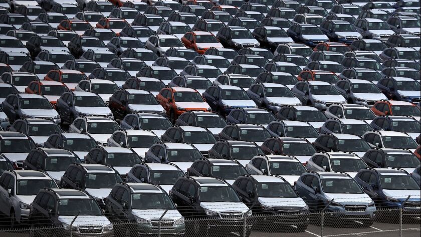 Brand new cars sit in a lot at the Auto Warehousing Company near the Port of Richmond on May 24.