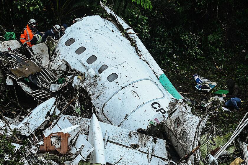 Teams work to recover the bodies of victims of the Nov. 29 plane crash that killed many members of the Brazilian football team Chapecoense Real.