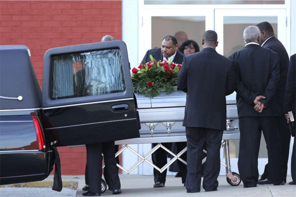 Pallbearers place a coffin with the body of Kansas City Chiefs player Jovan Belcher into a hearse after funeral services at the Landmark International Deliverance and Worship Center on Dec. 5.